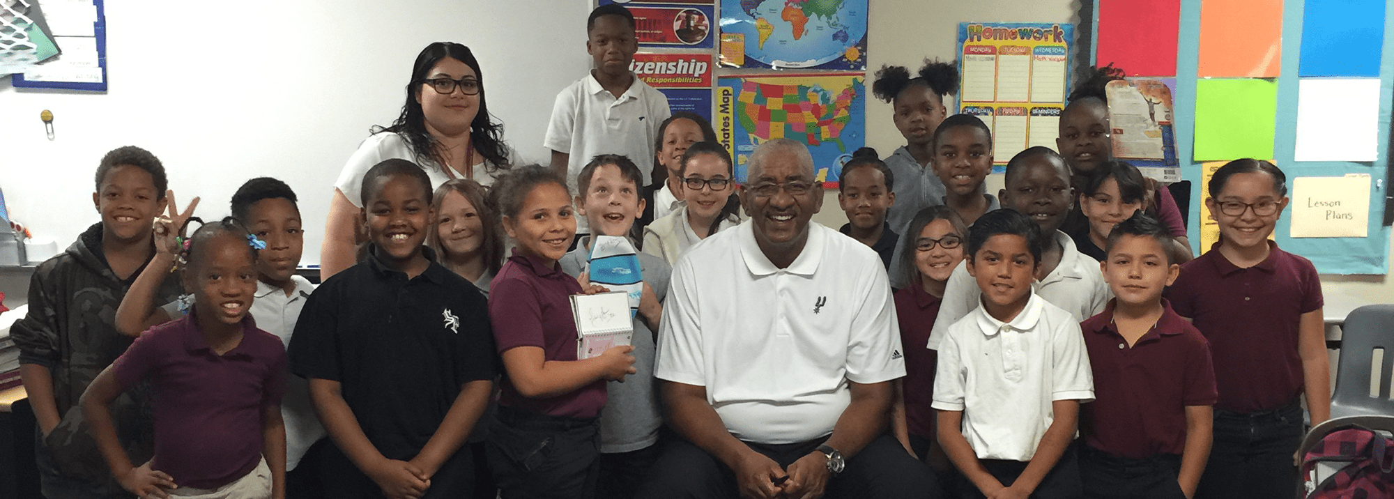 Group of students posing with George Gervin