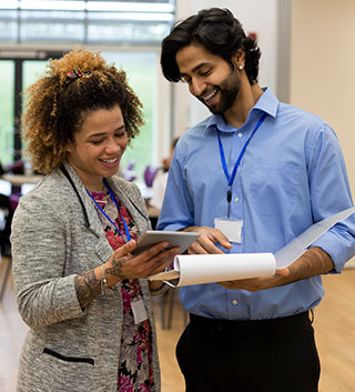 Man and woman discussing a project